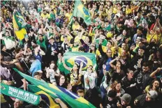  ?? Reuters ?? Bolsonaro’s supporters react in Sao Paulo after hearing news of his electoral victory in the presidenti­al run-off.