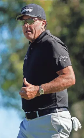  ?? ALLAN HENRY/USA TODAY SPORTS ?? Phil Mickelson reacts after making his putt on the seventh hole during the first round of the Charles Schwab Cup Championsh­ip.