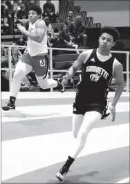  ?? Westside Eagle Observer/MIKE ECKELS ?? Tajae White (Gravette) rounds the final turn of the boys’ 200-meter run during the Arkansas High School Indoor Track Meet held at the Tyson Indoor Track Complex at the University of Arkansas in Fayettevil­le on Feb. 23.