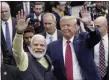  ?? MICHAEL WYKE—ASSOCIATED PRESS ?? In this Sept. 22, 2019, file photo, India Prime Minister Narendra Modi and President Donald Trump walk the perimeter of the arena floor to greet attendants after Modi’s speech during the “Howdi Modi” event at NRG Stadium in Houston. President Trump was ready for a king’s welcome as he headed to India on Sunday for a jam-packed two-day tour.