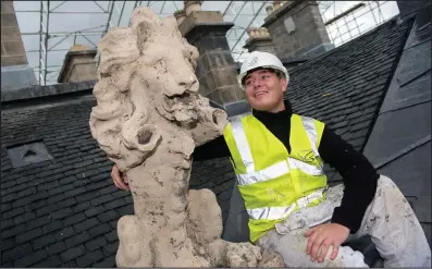  ??  ?? City Building employee Taylor Holliday with one of the lions from Pollok House