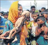  ?? REUTERS ?? Hamida, a Rohingya refugee woman, cries as she holds the body of her 40dayold son, who died as a boat capsized in the shore of Shah Porir Dwip, in Teknaf, Bangladesh, on Thursday.