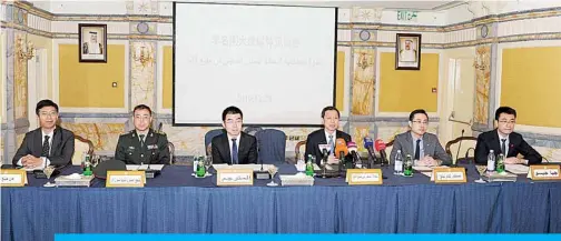  ??  ?? KUWAIT: Chinese Ambassador to Kuwait Li Minggang (fourth from left) speaks during the symposium. —KUNA