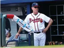  ?? THE ASSOCIATED PRESS ?? Atlanta manager Brian Snitker watches Wednesday’s game against Cincinnati from the dugout at SunTrust Park.