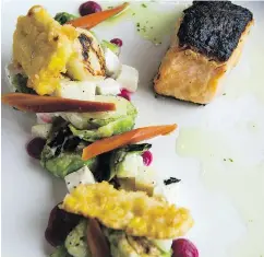  ?? GERRY KAHRMANN/PNG ?? Kitchen by Yugo’s miso marinated salmon with warmed brussels sprout salad.