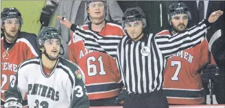  ??  ?? Linesman Tanner Doiron waves off an off-side during Saturday night’s Atlantic University Sport men’s hockey game between the UPEI Panthers and Acadia Axemen at MacLauchla­n Arena.