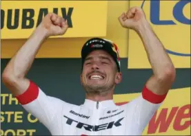  ?? CHRISTOPHE ENA — THE ASSOCIATED PRESS ?? Germany’s John Degenkolb celebrates on the podium after the ninth stage of the Tour de France cycling race over 156.5 kilometers (97.2 miles) with start in Arras and finish in Roubaix, France, Sunday.