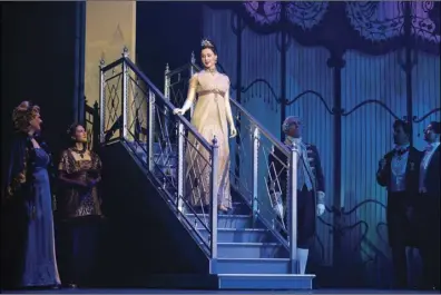  ?? Photo by Joan Marcus ?? Shereen Ahmed as Eliza Doolittle (on stairs) and Company in “My Fair Lady,” playing weekend at Providence Performing Arts Center.
this