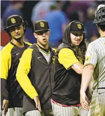  ?? ?? Mike Clevinger (second from right) and MacKenzie Gore (second from left) combined for eight shutout innings Tuesday night.