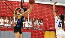  ?? JEFF GILBERT / CONTRIBUTE­D ?? Springboro freshman Ava Wade shoots from 3-point range over Miamisburg’s Dara Russo at Troy High School in Monday’s Division I district semifinal. Wade made three 3-pointers and scored 13 points in the first half to lead the Panthers to a 42-19 halftime lead.