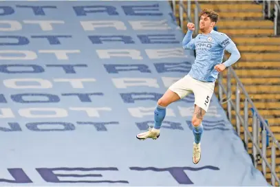  ?? Picture: AFP ?? HITTING HEIGHTS. Manchester City’s John Stones celebrates after scoring the opening goal during their English Premier League match against Crystal Palace at the Etihad on Sunday night.