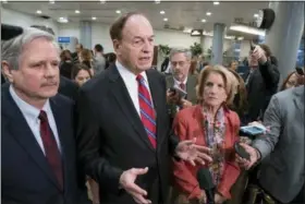 ?? J. SCOTT APPLEWHITE — THE ASSOCIATED PRESS ?? In this photo, Sen. Richard Shelby, R-Ala., the top Republican on the bipartisan group bargainers working to craft a border security compromise in hope of avoiding another government shutdown, is joined by Sen. John Hoeven, R-N.D., left, and Sen. Shelley Moore Capito, R-W.Va., right, as they speak with reporters in Washington. Congressio­nal bargainers seem close to clinching a border security agreement that would avert a fresh government shutdown, with leaders of both parties voicing optimism and the top GOP negotiator saying he believes President Donald Trump would back the emerging accord.