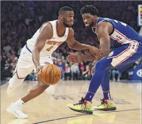 ?? Sarah Stier / Getty Images ?? Emmanuel Mudiay, dribbling past the 76ers’ Joel Embiid, scored 19 points for the Knicks, but missed a 3-point try that would have forced overtime.