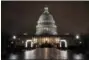  ?? J. SCOTT APPLEWHITE — THE ASSOCIATED PRESS ?? The Capitol is seen before dawn Wednesday after a night of negotiatin­g on the government spending bill, in Washington. Talks over a $1.3 trillion omnibus bill are almost complete as the White House and Capitol Hill Democrats ironed out deals on a first...