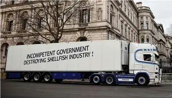  ??  ?? Net losses...seafood hauliers took their protest about EU export bureaucrac­y to London