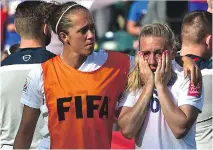  ?? ED KAISER/EDMONTON JOURNAL ?? A visibly shaken Laura Bassett is comforted by England teammate Jo Potter at the end of the match after losing to Japan 2-1 in the Women’s World Cup semifinal in Edmonton.