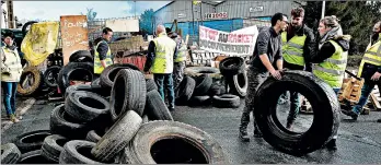  ?? JEAN-FRANCOIS MONIER/GETTY-AFP ?? Yellow vest protesters barricade access to an oil depot Tuesday in northweste­rn France.