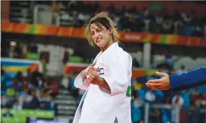  ?? (Asaf Kliger) ?? YARDEN GERBI celebrates after winning a bronze medal in the women’s under 63kg. judo competitio­n at the Rio Olympics on Tuesday.