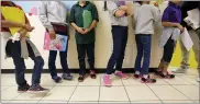  ?? ERIC GAY FILE — THE ASSOCIATED PRESS ?? Migrant teens in August 2019line up for a class at a “tender-age” facility for babies, children and teens, in Texas’ Rio Grande Valley.