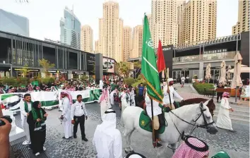  ?? Antonin Kélian Kallouche/Gulf News ?? Celebratio­n of Saudi National Day at Jumeirah Beach Residences in Dubai yesterday.