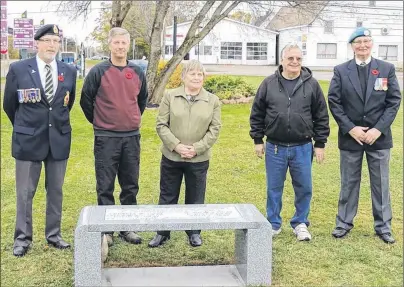  ?? SUBMITTED PHOTO ?? St. Anthony’s Legion branch members Alan Leard, left, and Don Irving, right, join members of the Gray family, from second left, Randy Gray, Lillian MacLean and Harold Gray during a dedication ceremony for a stone bench donated to the Alberton cenotaph...