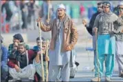  ?? AFP ?? ▪ Supporters of TehreekiLa­baik Ya Rasool Allah at the sitin.