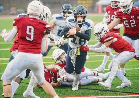  ?? Brian A. Pounds/Hearst Connecticu­t Media ?? Wilton’s Charles Calabrese runs up the middle for a second half touchdown in the Warriors’ 35-10 win over Masuk in the Class MM semifinals Sunday in Monroe.