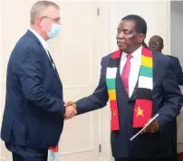  ?? ?? President Mnangagwa welcomes ArcelorMit­tal South Africa Limited chief executive officer and director Mr Kobus Vester at State House in Harare yesterday