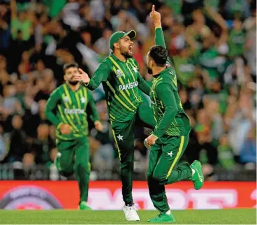  ?? (AFP) ?? Pakistan and their captain Babar Azam (C) have had plenty to celebrate in Australia despite a terrible start to their campaign