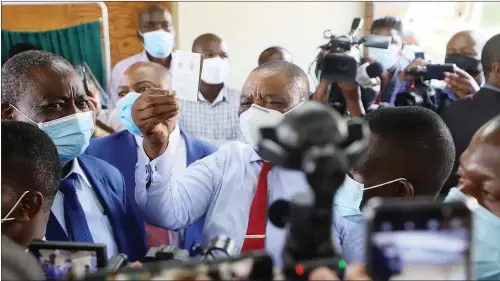  ??  ?? Vice-President Constantin­o Chiwenga shows off his vaccinatio­n card after being inoculated with the Chinese-donated Sinopharm COVID-19 vaccine at Wilkins Infectious Diseases Hospital in Harare on Thursday