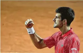  ?? Alfredo Falcone / Associated Press ?? Novak Ðjokovic enjoys his Italian Open victory in the first event since being defaulted from the U.S. Open for hitting a line judge with a ball.
