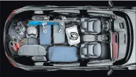  ??  ?? Numerous hidden storage compartmen­ts in the console, center arm rests and glove box, along with seatback pockets and door-panel bins, keep essential items close, but out of the way.