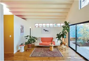  ?? Associated Press ?? ■ This undated photo shows a converted garage project by Bunch Design in the Highland Park area of Los Angeles. Long clerestory windows were placed high on the walls of a small living room. Afternoon light streams through a west-facing skylight, and a stepped ceiling creates more interestin­g light plays.