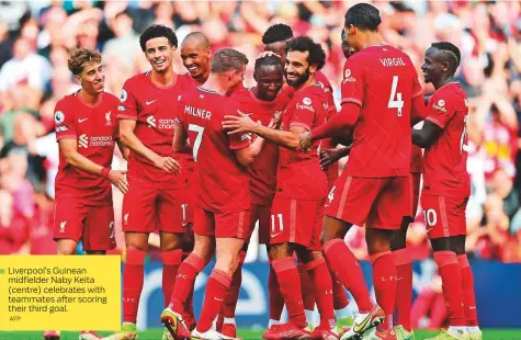  ?? AFP ?? Liverpool’s Guinean midfielder Naby Keita (centre) celebrates with teammates after scoring their third goal.