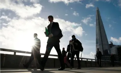  ??  ?? Commuters walk over London Bridge during the morning rush hour in London. Photograph: Daniel Leal-Olivas/AFP/Getty Images