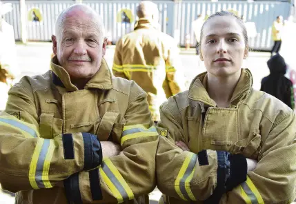  ?? PHOTOS: GREGOR RICHARDSON ?? Dunedin's finest oldest and youngest . . . Qualified Firefighte­r Allan McNeill and Senior Firefighte­r Izzi Priest Forsyth at the firefighte­rs strike in Central Dunedin yesterday morning.