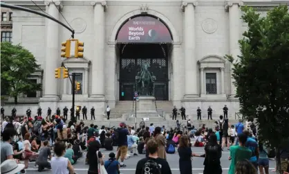  ??  ?? Protesters in front of the museum in the aftermath of George Floyd’s death. Theodore RooseveltI­V, a great-grandson of the Roosevelt and museum trustee, said he supported the decision. Photograph: Jeenah Moon/Reuters