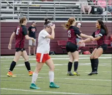  ?? Graham Thomas/Siloam Sunday ?? Siloam Springs sophomore Madi Race, No. 13, and senior Laura Morales embrace after Race scored a goal to tie Wednesday’s match against Russellvil­le 1-1. The match went to “kicks from the mark,” where Russellvil­le outshot Siloam Springs 3-2 to take the victory.