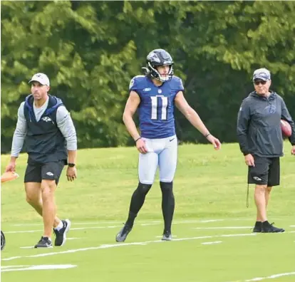  ?? KEVIN RICHARDSON/BALTIMORE SUN PHOTOS ?? Ravens punter Jordan Stout, center, works with former punter Sam Koch, left, and kicking coach Randy Brown at practice on Wednesday.“For me, when you find a punter, you hear a punter,” Brown said.