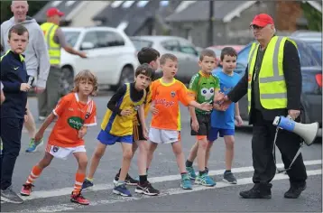  ??  ?? Nearly Ready....Tommy Neary keeps the eager Boys U-9 runners on the line.