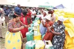  ?? ?? Agric4She patron First Lady Dr Auxillia Mnangagwa joins women in song and dance as they celebrate the inputs and trees she gave them in Mashonalan­d East