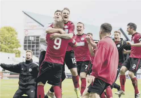  ?? PICTURE: ROB CASEY/SNS ?? 0 Brechin City players dance with joy following their shoot-out victory over Raith Rovers.