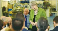 ?? (Reuters) ?? BRITISH PRIME MINISTER Theresa May speaks yesterday with workers at the Cross Manufactur­ing Company in Bath.