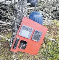  ?? CAPE BRETON POST PHOTO ?? Some electronic equipment and vinyl boat fenders are propped against a tree about 50 metres from where a sailboat is beached in Gabarus.