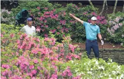  ?? ROB SCHUMACHER/THE REPUBLIC ?? Jordan Spieth, right, reacts after an errant tee shot as Collin Morikawa watches during the second round of the Masters on Friday.