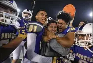  ?? JOSE CARLOS FAJARDO — BAY AREA NEWS GROUP ?? Serra head coach Patrick Walsh is mobbed by his players after defeating Cajon during their 2017 CIF State Football Championsh­ip Division 2-AA Bowl Game.