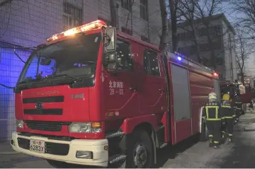  ??  ?? Firemen work at the site of an explosion at Beijing Jiaotong University in Beijing. — AFP photo