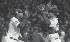  ?? JERRY LAI, USA TODAY SPORTS ?? Closer Aroldis Chapman and catcher Willson Contreras celebrate the Cubs’ 3-2 victory in Game 5 on Sunday.