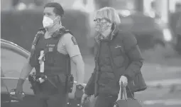  ?? FIONA GOODALL/GETTY ?? Police escort people from Lynnmall to their cars after a lone individual stabbed six people before being shot by police Friday in Auckland, New Zealand.