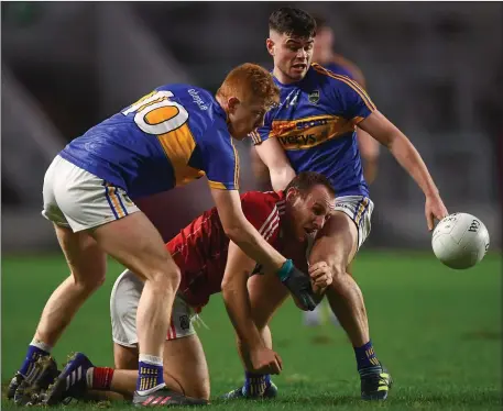  ??  ?? Brian O’Driscoll of Cork in action against Josh Keane, left, and Michael Quinlivan of Tipperary during the Allianz Football League Division 2 Round 1 match between Cork and Tipperary at Páirc Uí Chaoimh in Cork. Photo by Stephen McCarthy/Sportsfile